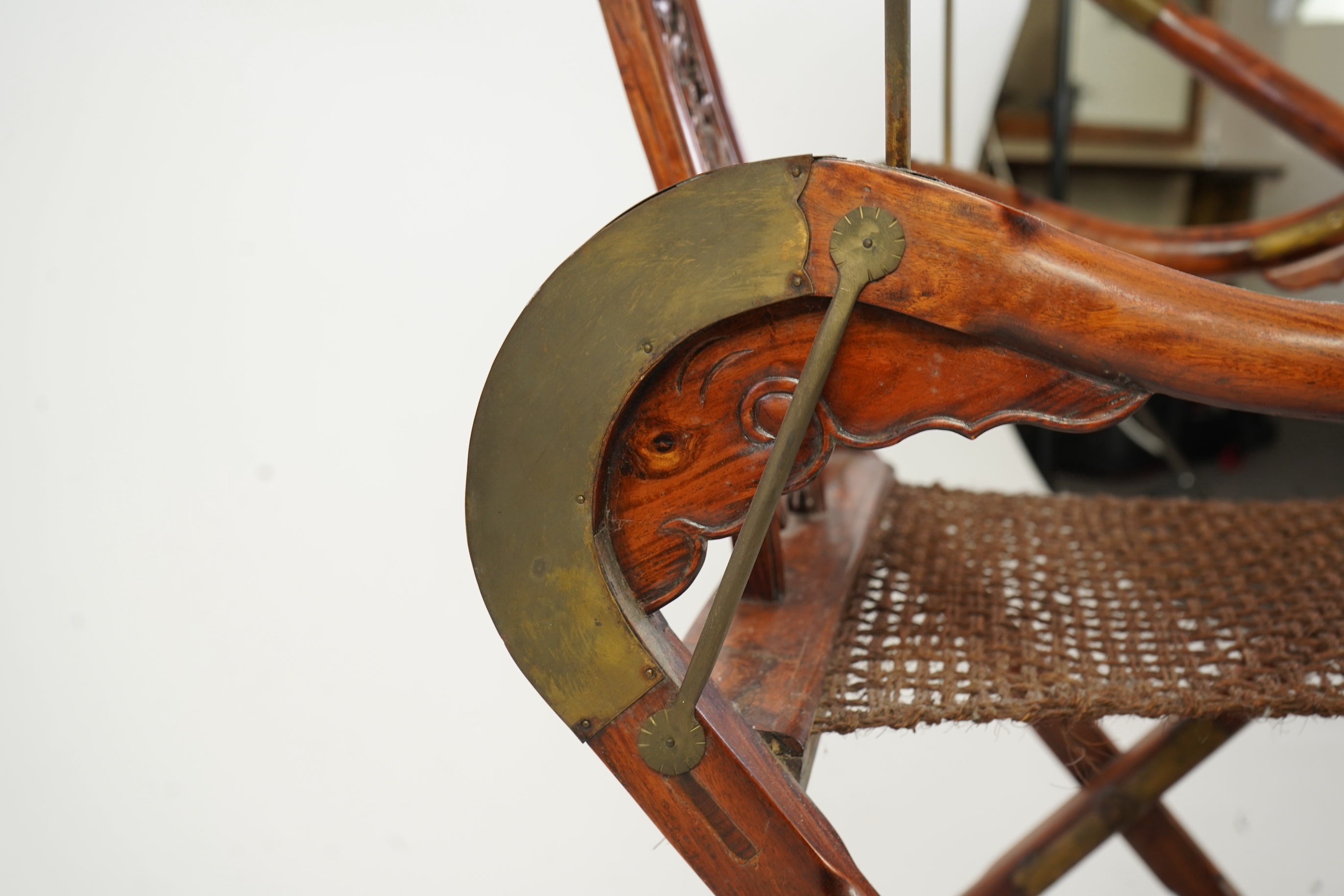 A Chinese huanghuali, hongmu and brass mounted folding hunting chair, jiaoyi, early 20th century